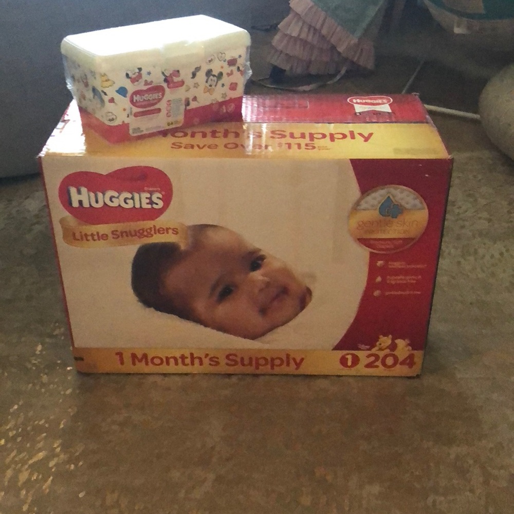 Box of 204 Huggies diapers size 1 & box of wipes
